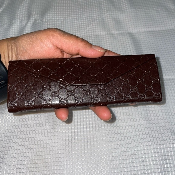 brown leather monogrammed foldable eyeglasses case from Gucci. - Picture 13 of 16